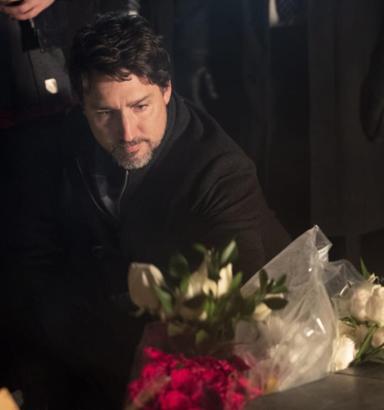 Canadian Prime Minister Justin Trudeau participates in a candlelight vigil to remember the victims of the Ukraine International Airlines plane crash, Thursday, Jan. 9, 2020, in Ottawa, Ontario.