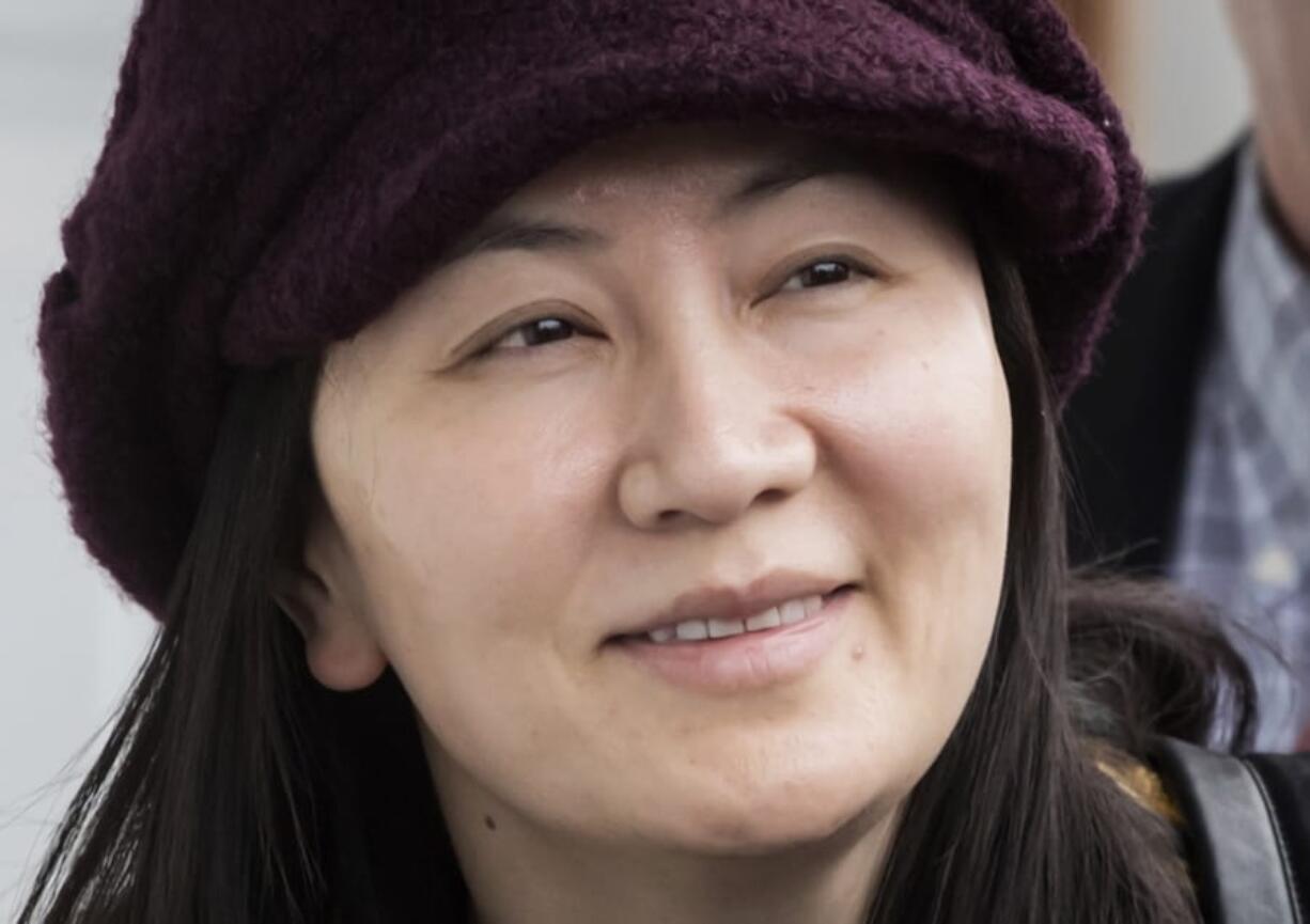 Meng Wanzhou, chief financial officer of Huawei leaves her home in Vancouver, Monday, January, 20, 2020. A court hearing begins today in Vancouver over the American request to extradite an executive of the Chinese telecom giant Huawei on fraud charges.