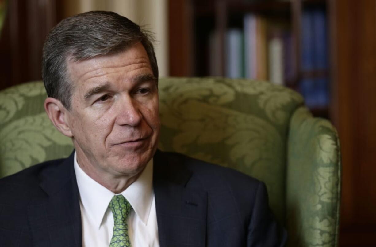 FILE - In this Wednesday, Dec. 19, 2018 file photo, North Carolina Gov. Roy Cooper responds during an interview at the Governor&#039;s mansion in Raleigh, N.C. Many of North Carolina Democratic Gov. Roy Cooper&#039;s lasting achievements in 2019 stem from keeping Republican policies from ever getting implemented. During a year-end interview with The Associated Press on Wednesday, Dec. 18, 2019 Cooper cited successes in recruiting companies and jobs to the state, reducing the number of opioid deaths and moving the state toward cleaner energy during the third year of his term.