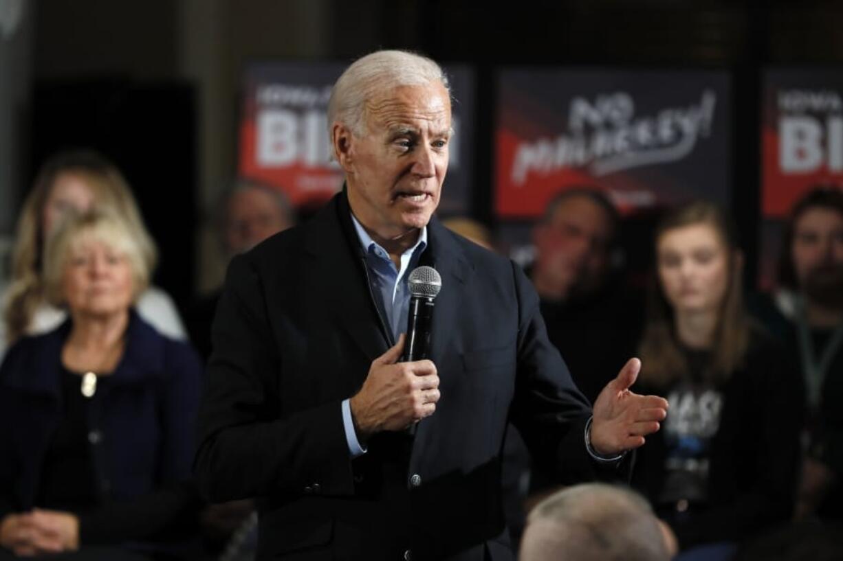 FILE - In this Sunday, Dec. 1, 2019, file photo, Democratic presidential candidate and former Vice President Joe Biden speaks during a meeting with local residents at Buena Vista University, in Storm Lake, Iowa. Biden has landed a high-profile endorsement for his presidential bid as U.S. Rep. Abby Finkenauer becomes the first member of the Iowa congressional delegation to take sides in the Democratic nominating contest.