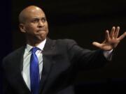 FILE - In this June 1, 2019 file photo, Democratic presidential candidate Sen. Cory Booker, of New Jersey, waves before speaking during the 2019 California Democratic Party State Organizing Convention in San Francisco.  Booker has dropped out of the presidential race after failing to qualify for the December primary debate.