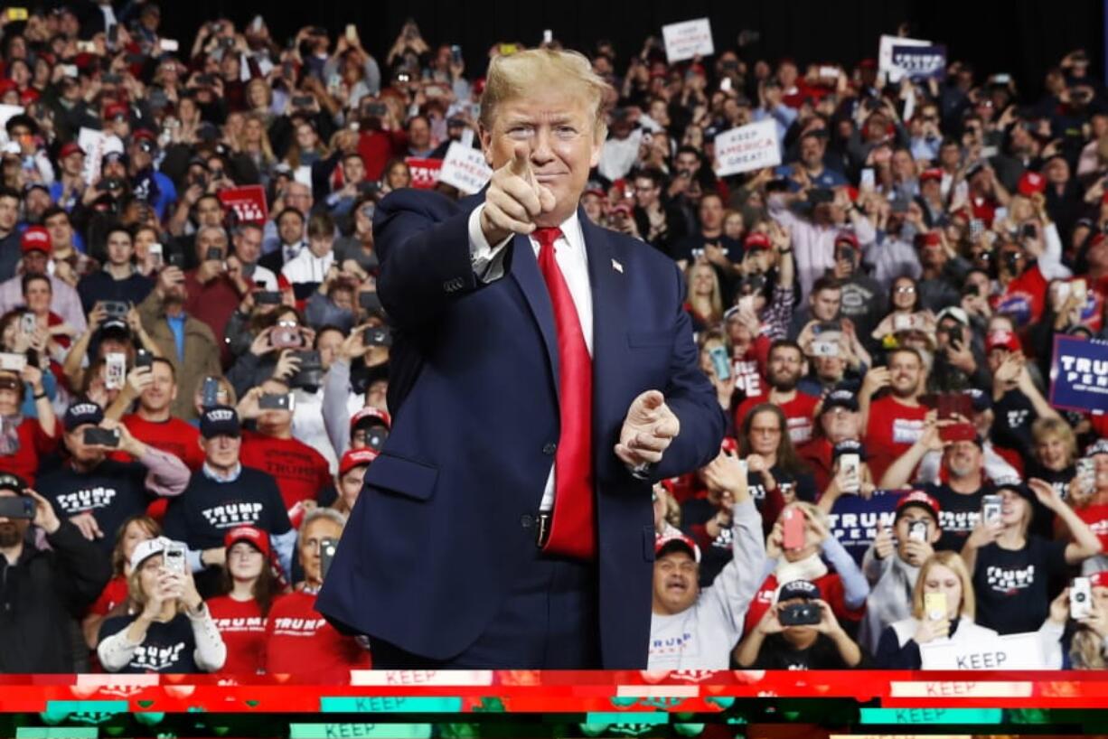 FILE - In this Jan. 9, 2020, file photo, President Donald Trump points as he arrives to speak at a campaign rally, in Toledo, Ohio. As the Democratic primary intensifies ahead of the first voting contests, President Donald Trump and his allies have issued a series of favorable comments about Democrat Bernie Sanders. It&#039;s a strategy aimed at trying to take advantage of Democratic divisions and trying to attract some Sanders&#039; supporters to Trump&#039;s campaign if the senator is not his party&#039;s nominee.