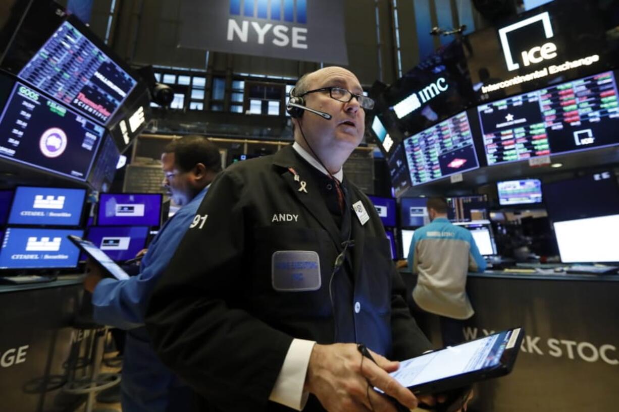 FILE - In this Jan. 10, 2020, file photo trader Andrew Silverman works on the floor of the New York Stock Exchange. The U.S. stock market opens at 9:30 a.m. EST on Wednesday, Jan. 15.