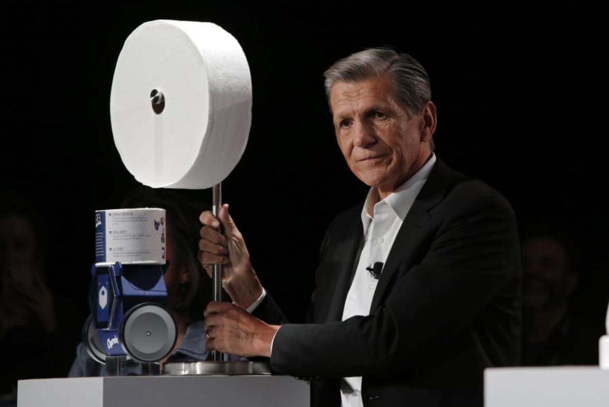 Procter &amp; Gamble Chief Brand Officer Marc Pritchard shows off the Charmin Forever Roll and the Charmin RollBot during a Procter &amp; Gamble news conference before CES International, Sunday, Jan. 5, 2020, in Las Vegas.