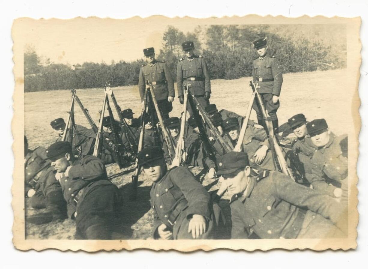 This spring 1943 photo provided by the U.S. Holocaust Memorial Museum shows a group of auxiliary guards at the Nazi death camp Sobibor in German-occupied Poland. A Holocaust historian said researchers concluded that John Demjanjuk, the retired Ohio auto worker who was tried in Germany for his alleged time as a Sobibor guard, is presumably depicted in this photo. (U.S.