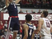 Gonzaga forward Filip Petrusev (3) dunks in front of guard Ryan Woolridge (4) and Santa Clara forward Josip Vrankic (13) during the first half of an NCAA college basketball game in Santa Clara, Calif., Thursday, Jan. 30, 2020.