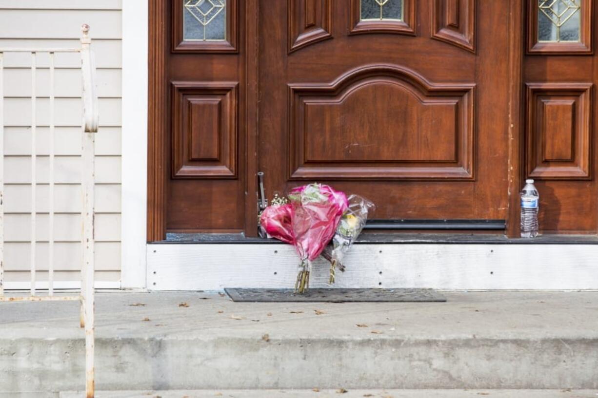 Flower bouquets rest on the doorstep of a rabbi&#039;s residence in Monsey, N.Y., Sunday, Dec. 29, 2019, following a stabbing Saturday night during a Hanukkah celebration.