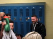 Evergreen boys basketball coach Brett Henry, right, reacts to being drenched with water as his players celebrate after a 56-44 win over Kelso on Friday in Kelso (Micah Rice/The Columbian)