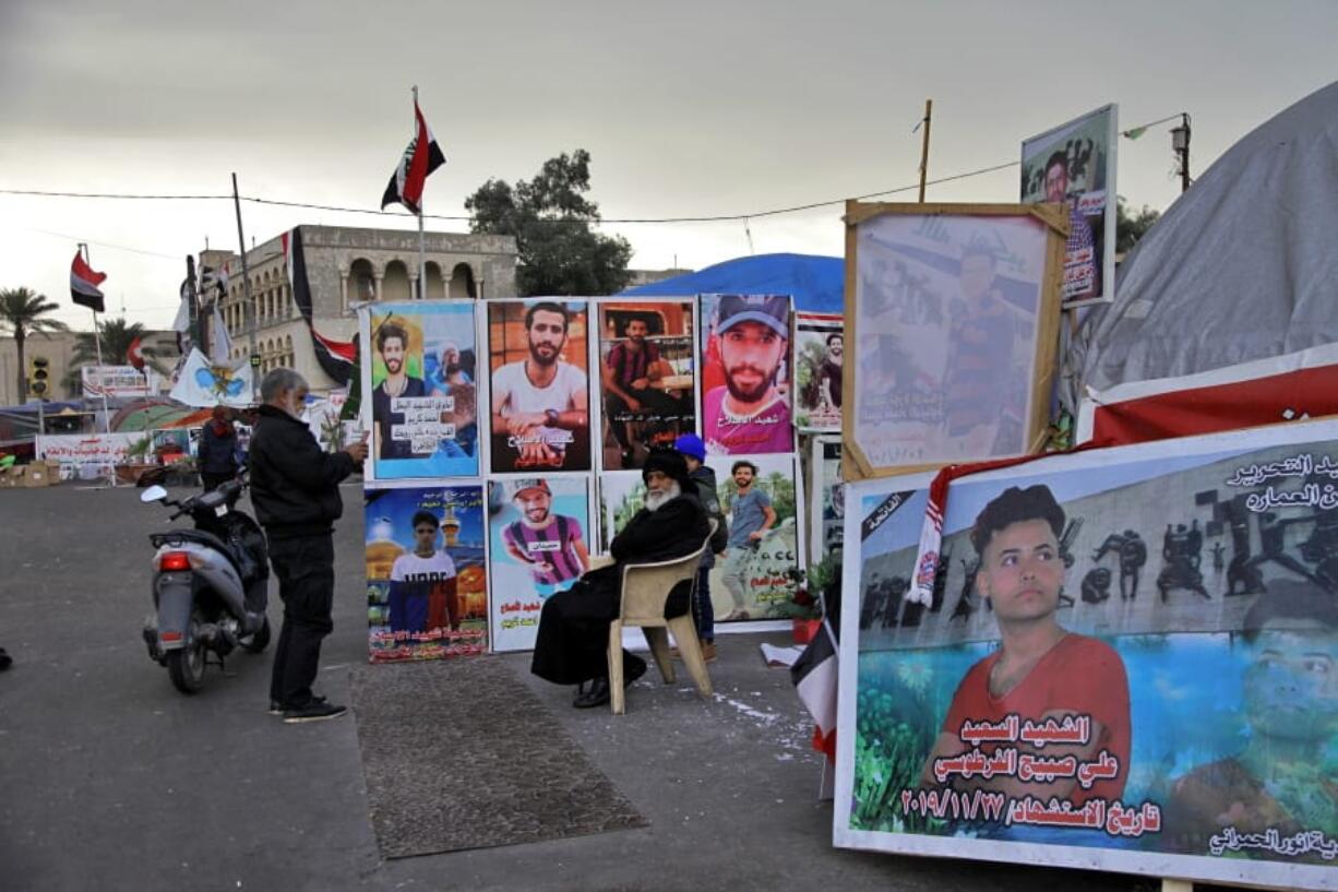 Posters of anti-government protesters who have been killed in demonstrations are displayed in Tahrir Square during ongoing protests in Baghdad, Iraq, Wednesday, Jan. 8, 2020.