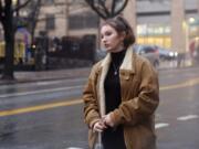 In this Dec. 30, 2019, photo, Shoshana Blum, a 20-year-old junior at City College of New York, waits for a taxi in New York. Despite having been victim to a verbal and physical anti-Semitic attack on the subway, Blum wears her Star of David pendant, a visible marker of her Jewish identity, proudly.