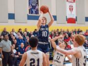 King's Way Christian's Bryson Metz makes a jumper over Seton Catholic defenders in the Knights' 75-65 win on Wednesday.