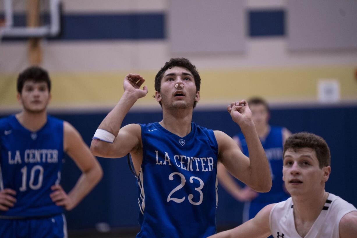 La Center's Hunter Ecklund attempts a free throw late after being treated for a bloody nose late in the Wildcats' 71-67 win at Seton Catholic on Thursday. (Photo courtesy of N.