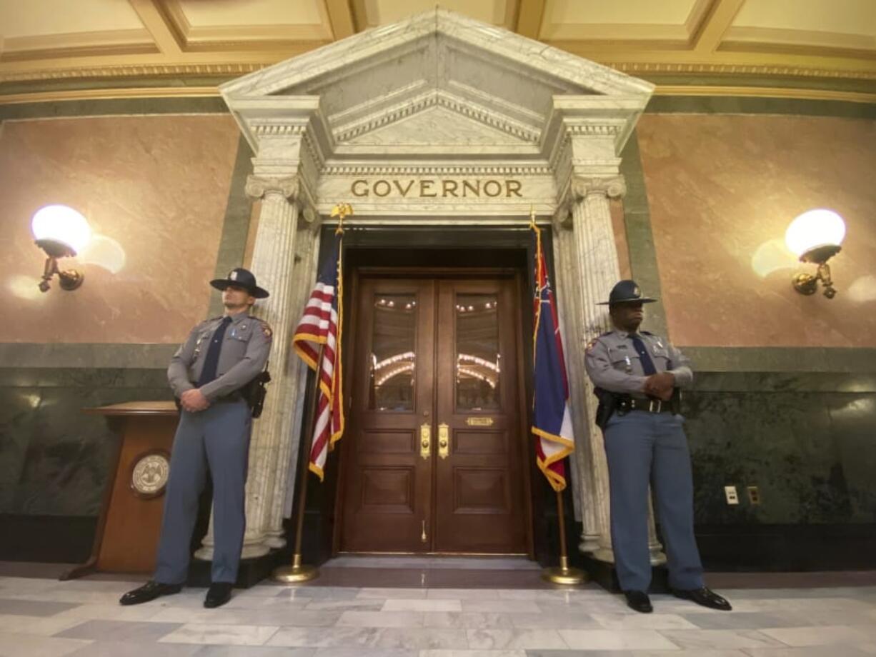 Guards stand watch outside the Governor&#039;s executive office before the start of the gubernatorial inauguration ceremony for Tate Reeves at the Capitol in Jackson, Miss. Tuesday, Jan. 14, 2020.