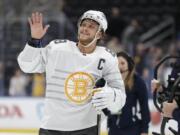 Boston Bruins forward David Pastrnak waves to the crowd as he is named the most valuable player of the NHL hockey All Star games Saturday, Jan. 25, 2020, in St. Louis.