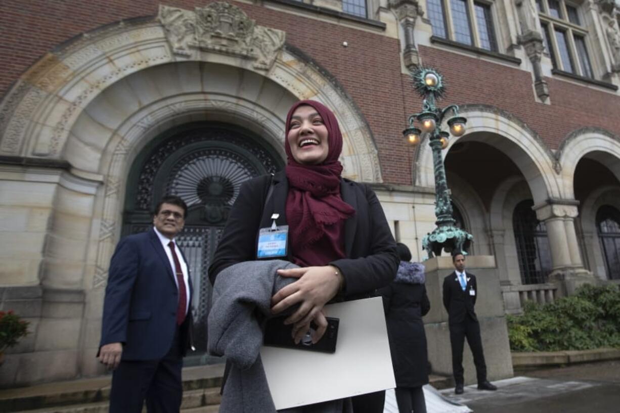 Yasmin Ullah, a member of the Rohingya community, is all smiles as she walks out of the International Court in The Hague, Netherlands, Thursday, Jan. 23, 2020, after the court ordered Myanmar take all measures in its power to prevent genocide against the Rohingya. The United Nations&#039; top cour issued a decision on a request by Gambia.