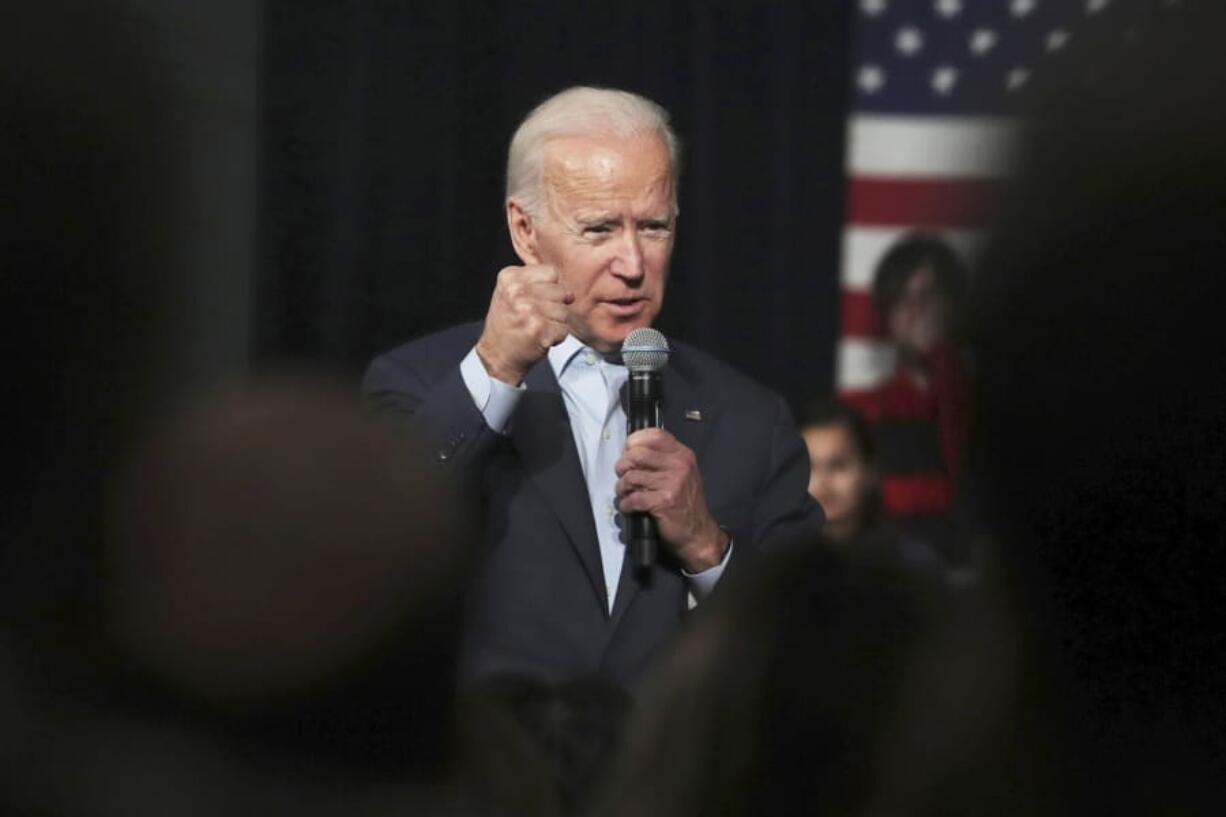 FILE - In this Monday, Dec. 30, 2019 file photo, Democratic presidential candidate former Vice President Joe Biden addresses a gathering during a campaign stop in Exeter, N.H. A video of Biden that was selectively edited to suggest he made racist remarks during a recent speech was making the rounds Thursday, Jan, 2, 2020 on social media, raking in more than a million views on one tweet alone.