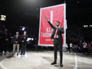 Golden State Warriors and former Washington State guard Klay Thompson speaks as the school retired his jersey number during halftime of an NCAA college basketball game between Washington State and Oregon State in Pullman, Wash., Saturday, Jan. 18, 2020.