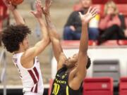 Washington State forward CJ Elleby (2) attempts a shot as Oregon forward Shakur Juiston (10) defends during the first half of an NCAA college basketball game Thursday, Jan. 16, 2020, in Pullman, Wash.