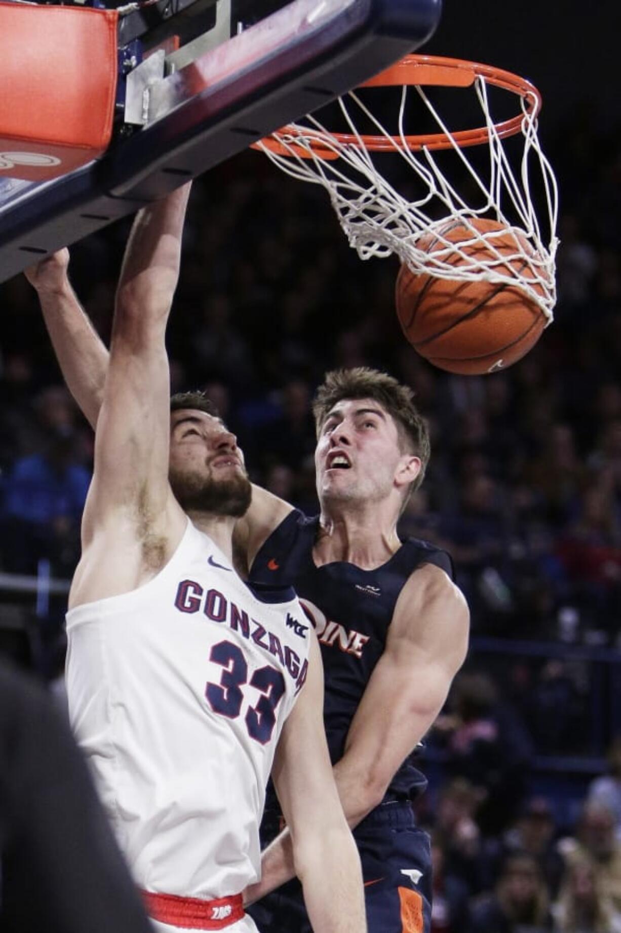 Gonzaga&#039;s Killian Tillie (33) dunks in front of Pepperdine&#039;s Skylar Chavez during the second half Saturday.