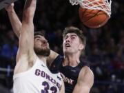 Gonzaga&#039;s Killian Tillie (33) dunks in front of Pepperdine&#039;s Skylar Chavez during the second half Saturday.