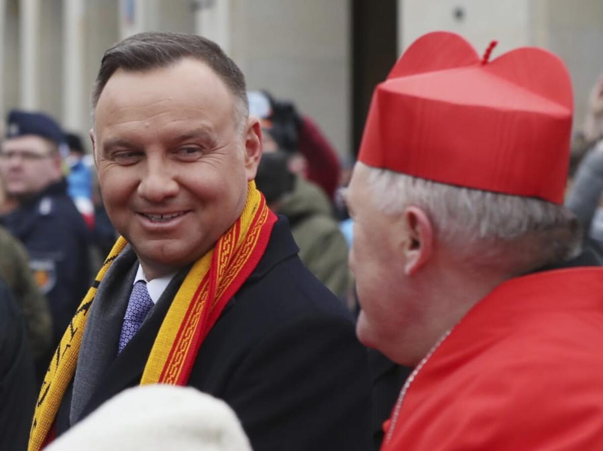 Polish President Andrzej Duda, left, and Archbishop of Warsaw Cardinal Kazimierz Nycz attend the 12th annual Epiphany procession in Warsaw, Poland, Monday, Jan. 6, 2020. Epiphany, the 12th night of Christmas, marks the day the three kings visited Christ.