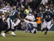 Seattle Seahawks&#039; Russell Wilson slides during the second half of an NFL wild-card playoff football game against the Philadelphia Eagles, Sunday, Jan. 5, 2020, in Philadelphia.