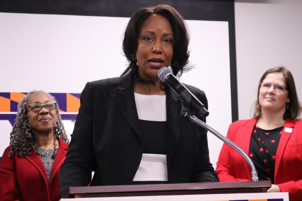 In this Jan. 27, 2020 photo, Maya Rockeymoore Cummings, who is running for her late husband&#039;s congressional seat in a special primary in Maryland, speaks at a news conference in Baltimore, Md. Emily Cain, executive director of EMILY&#039;s List, is standing right. Helen Holton, a former Baltimore City Councilwoman, is standing left.