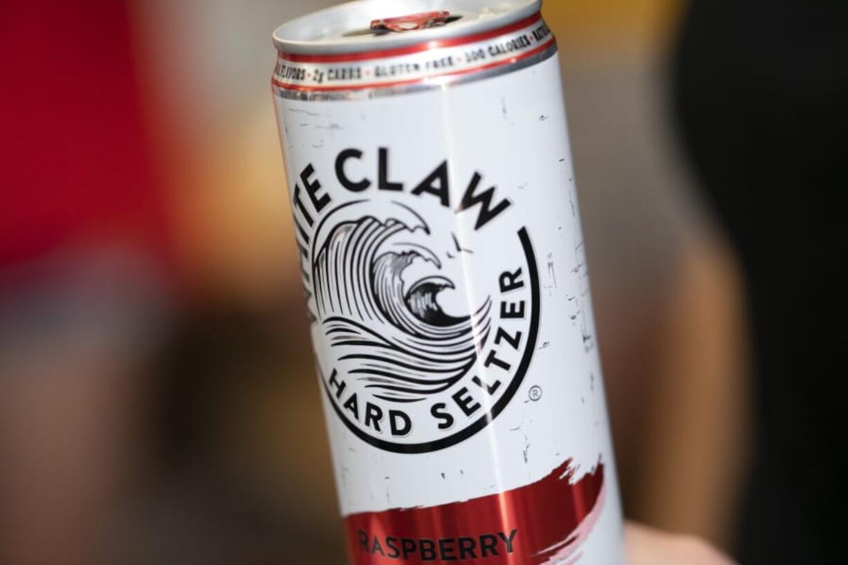 This Aug. 8, 2019, photo shows a White Claw in New Orleans. Sales of White Claw and other fruity, alcoholic seltzers soared this summer as drinkers looked for lighter, healthier options.