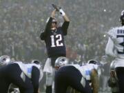 New England Patriots quarterback Tom Brady walks to the sideline after a series of plays in the first half of an NFL wild-card playoff football game against the Tennessee Titans, Saturday, Jan. 4, 2020, in Foxborough, Mass.