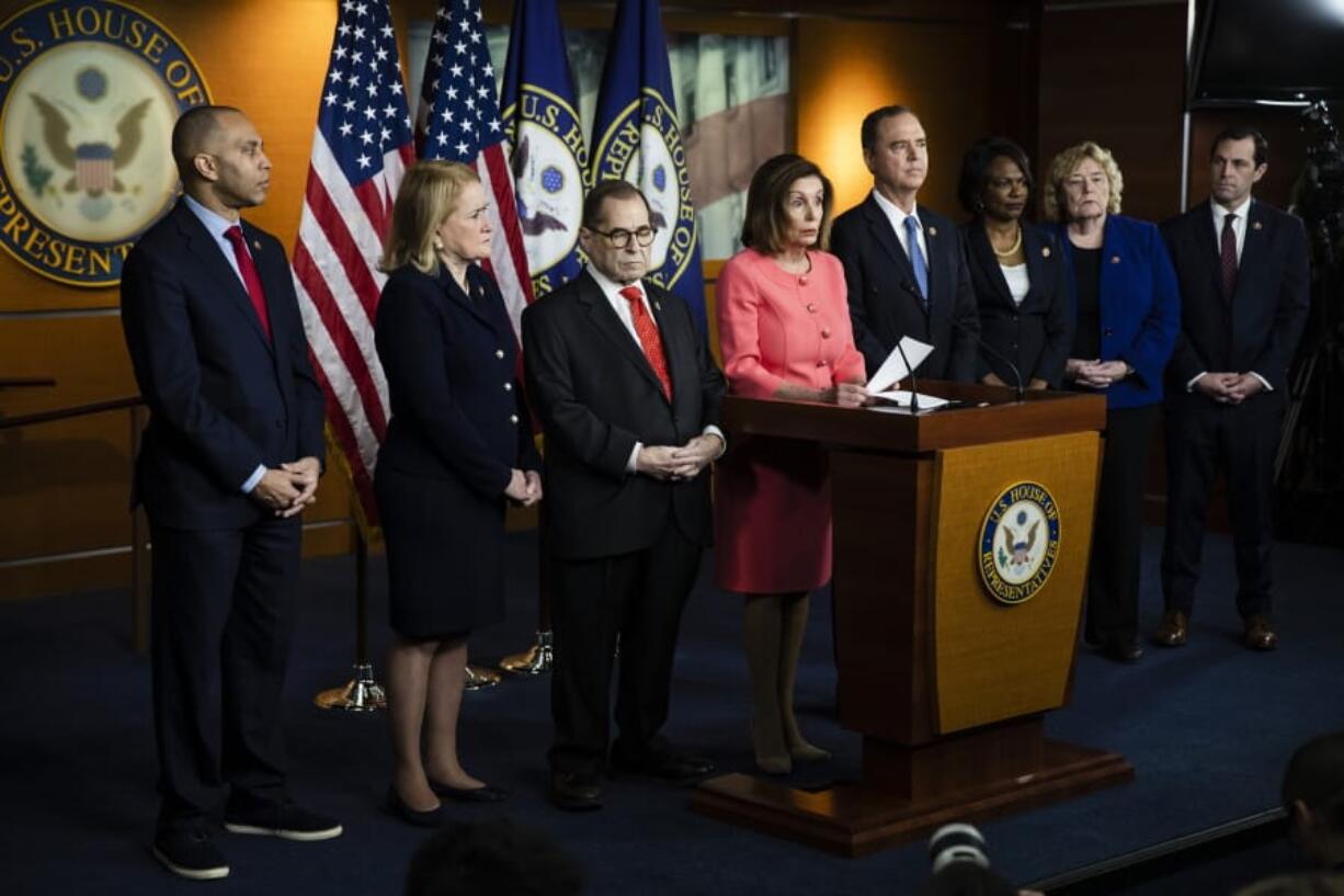 House Speaker Nancy Pelosi of Calif., speaks during a news conference to announce impeachment managers on Capitol Hill in Washington, Wednesday, Jan. 15, 2020. With Pelosi from left are Rep. Hakeem Jeffries, D-N.Y., Rep. Sylvia Garcia, D-Texas, House Judiciary Committee Chairman, Rep. Jerrold Nadler, D-N.Y., Pelosi, House Intelligence Committee Chairman Adam Schiff, D-Calif., Rep. Val Demings, D-Fla., Rep. Zoe Lofgren, D-Calif. and Rep. Jason Crow, D-Colo.