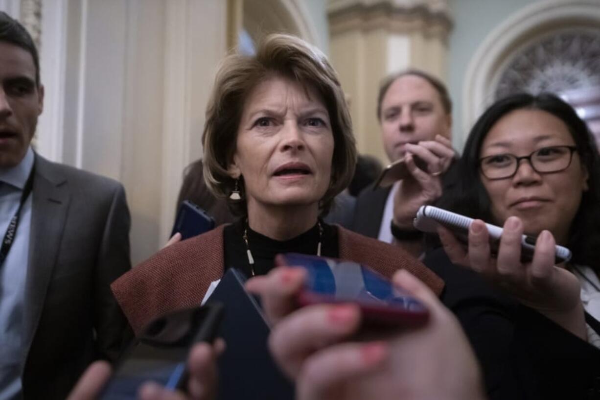 Sen. Lisa Murkowski, R-Alaska, arrives at the Senate for the start of the impeachment trial of President Donald Trump on charges of abuse of power and obstruction of Congress, at the Capitol in Washington, Tuesday, Jan. 21, 2020. (AP Photo/J.