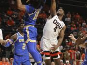 UCLA&#039;s Tyger Campbell (10) blocks a basket by Oregon State&#039;s Alfred Hollins (4) during the first half of an NCAA college basketball game in Corvallis, Ore., Thursday, Jan. 23, 2020.