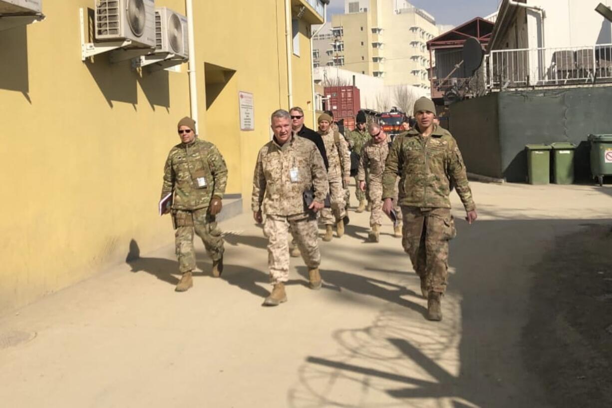 Marine Gen. Frank McKenzie, center, top U.S. commander for the Middle East, makes an unannounced visit, Friday, Jan. 31, 2020 in Kabul, Afghanistan.