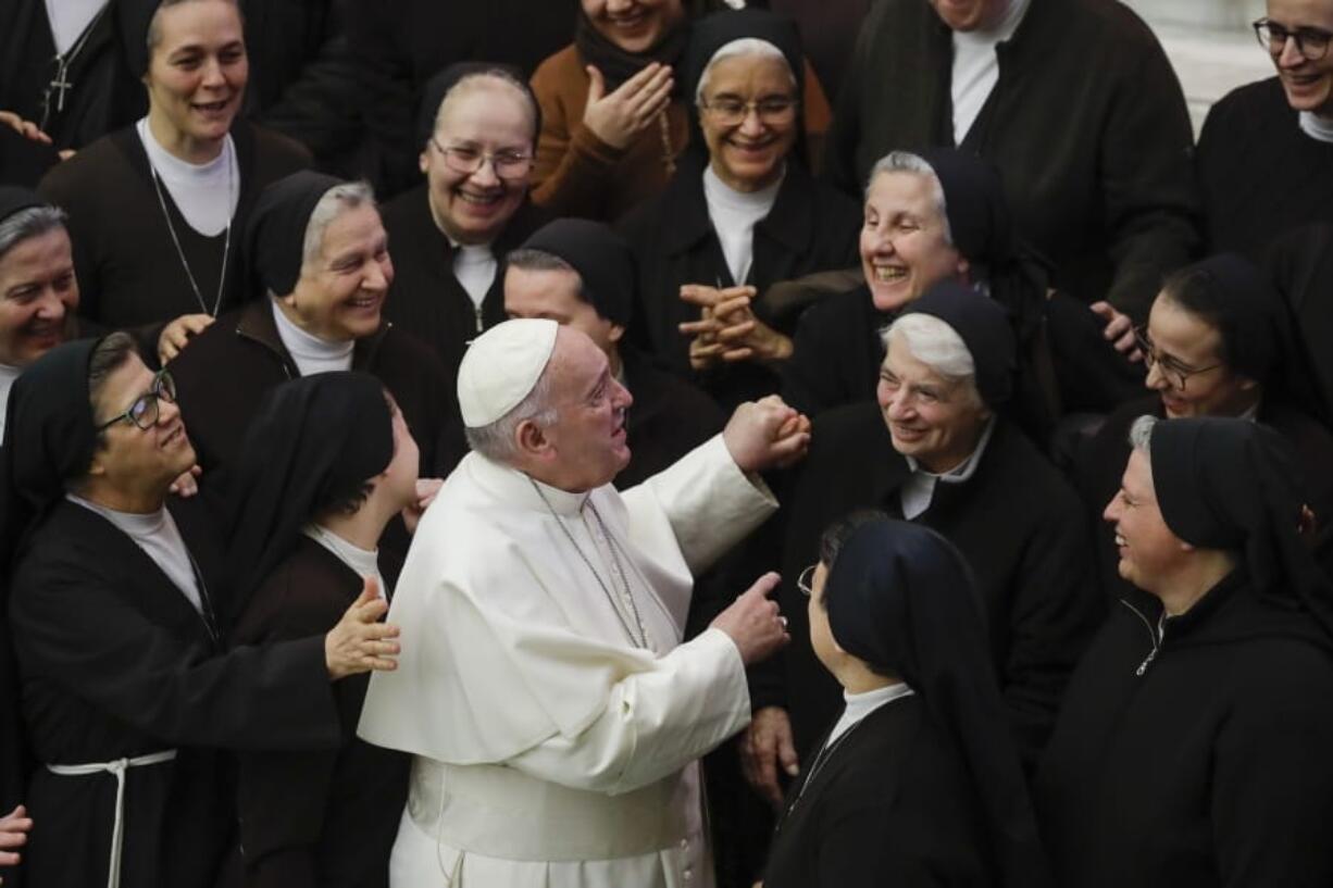 Pope Francis greets a group of nuns during his weekly general audience, in Paul VI Hall at the Vatican, Wednesday, Jan. 15, 2020.