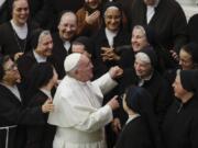 Pope Francis greets a group of nuns during his weekly general audience, in Paul VI Hall at the Vatican, Wednesday, Jan. 15, 2020.