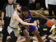 Washington forward Isaiah Stewart, right, drives into Colorado forward Lucas Siewert in the second half of an NCAA college basketball game Saturday, Jan. 25, 2020, in Boulder, Colo.