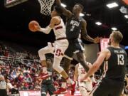 Stanford guard Tyrell Terry, left, shoots as Washington State forward Daron Henson (3) defends during the first half of an NCAA college basketball game Saturday, Jan. 11, 2020, in Stanford, Calif.