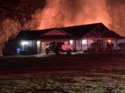 A witness caught this photo of a shop fire behind a home northeast of WSU Vancouver before firefighters arrived Saturday evening.