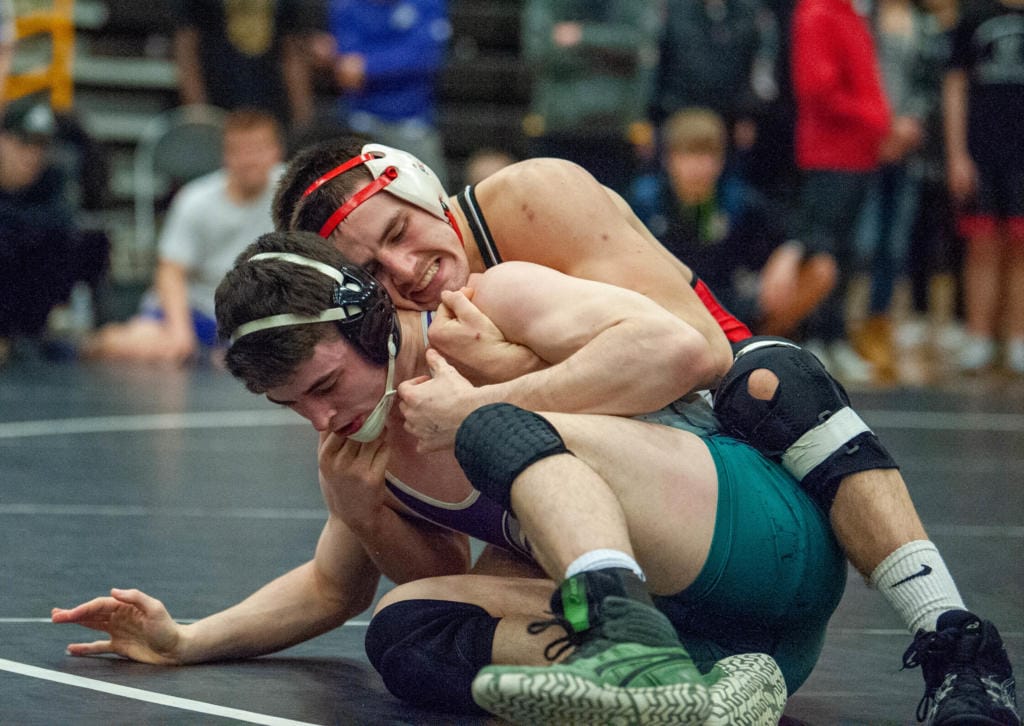 Camas' Gideon Malychewski (160) pulls Heritage's Alex Newberry back into the circle in the 4A Sub-Regional Championship match on Saturday at Hudson's Bay High School.