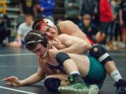 Camas' Gideon Malychewski (160) pulls Heritage's Alex Newberry back into the circle in the 4A Sub-Regional Championship match on Saturday at Hudson's Bay High School.