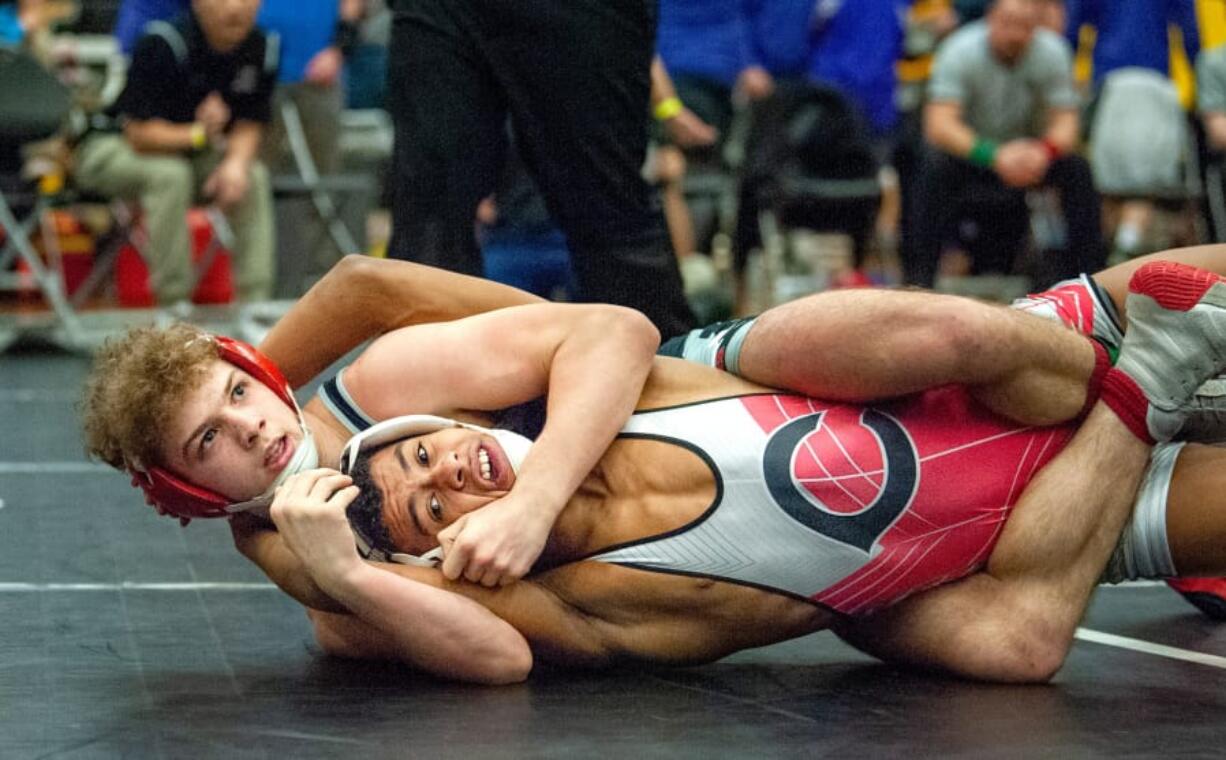 Union&#039;s Ryan Esperto (126 pounds) picks up near fall points against Camas&#039; Devin Padilla in the 4A Sub-Regional Championship match on Saturday at Hudson&#039;s Bay High School.