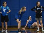 La Center&#039;s Natasha Lewis, from left, Kylee Stephens, Gianna DiEmilio, and Mia Edwards rest in between drills during a practice.