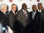 Posing for a photo during the launch ceremony for the centennial celebration of the Negro Leagues, Thursday, Feb. 13, 2020, in Kansas City, Mo., are, from left to right, Kansas City Royals owner John Sherman, Major League Baseball Commissioner Rob Manfred, Negro Leagues Baseball Museum President Bob Kendrick, Kansas City Mayor Quinton Lucas and Jackson County executive Frank White. Kansas City is home of the Negro Leagues Museum and was home of the Negro Leagues team the Kansas City Monarchs.