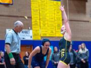 Hudson's Bay's Allison Blaine celebrates her win over Rogers' Kimber Jackson in their 135-pound championship match at the WIAA Girls Region 3 Tournament on Saturday at Kelso.