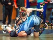 Union&#039;s Nevaeh Cassidy, top, takes down Curtis&#039; Katrina Wangen in their 155-pound championship match at the WIAA Girls Region 3 Tournament.