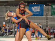 Ridgefield's Tyla Engstrom competes in a 110-pound quarterfinal matchup at Mat Classic XXXII on Friday at the Tacoma Dome.