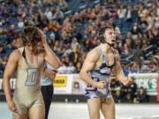 Union&#039;s Kyle Brosius celebrates an 11-7 decision win over Decatur&#039;s Bradley Tyack in the 170-pound championship Saturday at Mat Classic XXXII.