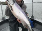 Casey Finn of Beaverton, Ore., shows off a nice Columbia River spring Chinook caught while fishing with guide Bob Rees last season.