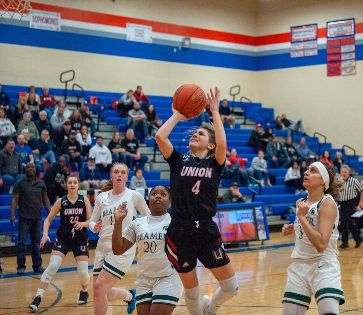 Union's Mason Oberg weaves in between the Todd Beamer defense during a 4A Regional game on Friday at Auburn Mountain View High School.