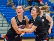 Union's Lolo Weatherspoon, left, and Mason Oberg celebrate their 48-47 win over Todd Beamer in a 4A State Regional on Friday at Auburn Mountainview High School.